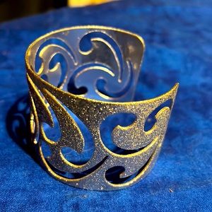 Beautiful gold tone metal cuff bracelet